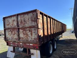 FLAT DECK TRASH TRAILER,  SLIDING TANDEM AXLE, 11R22.5 TIRES ON STEEL BUDDS