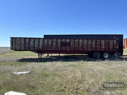 FLAT DECK TRASH TRAILER,  SLIDING TANDEM AXLE, 11R22.5 TIRES ON STEEL BUDDS