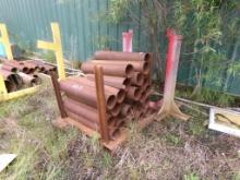 LARGE LOT WITH METAL RACKS W/CONTENTS BESIDE BUILDING