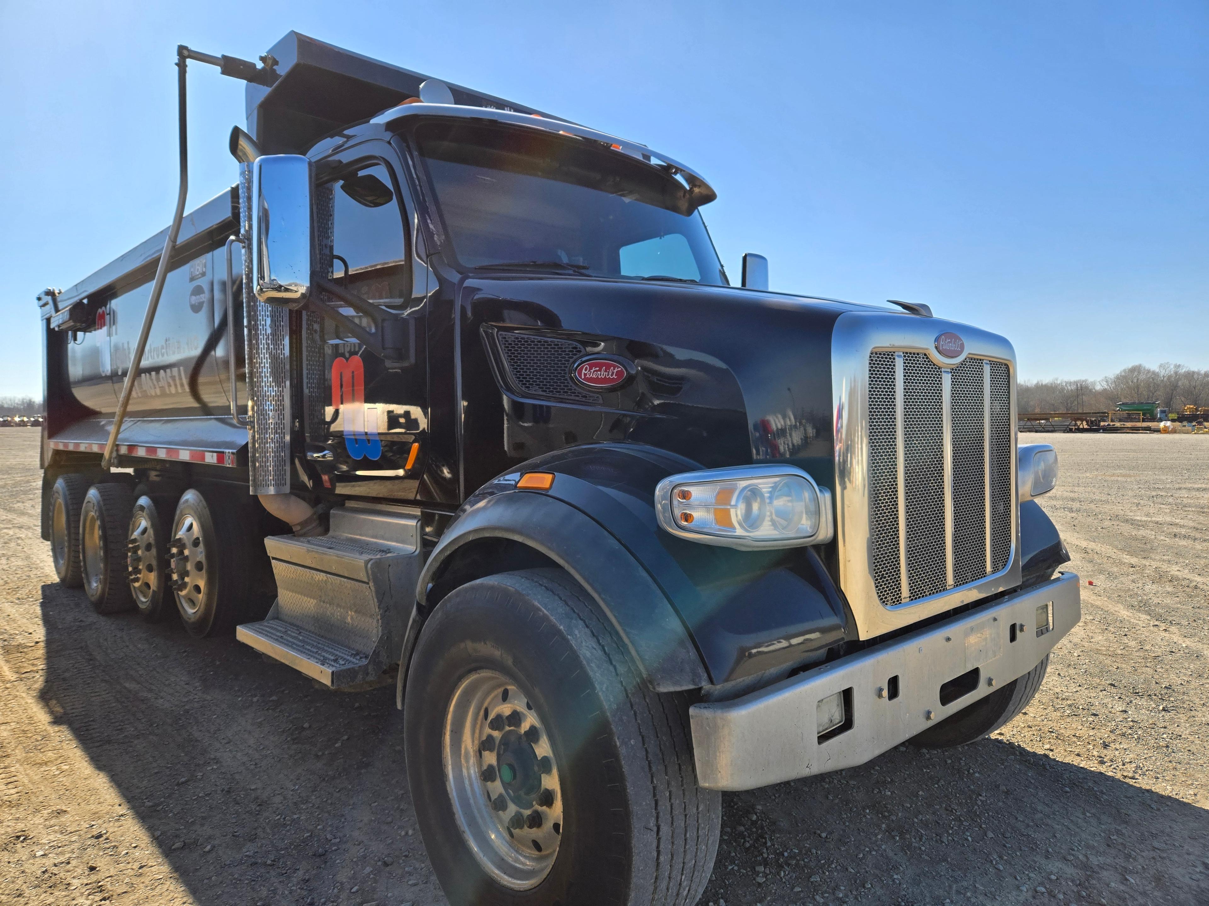 2018 PETERBILT 567 DUMP TRUCK, (+/-) 427,097  PACCAR DIESEL, AUTO TRANS, J