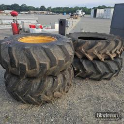 (4) Equipment Tires on wheels