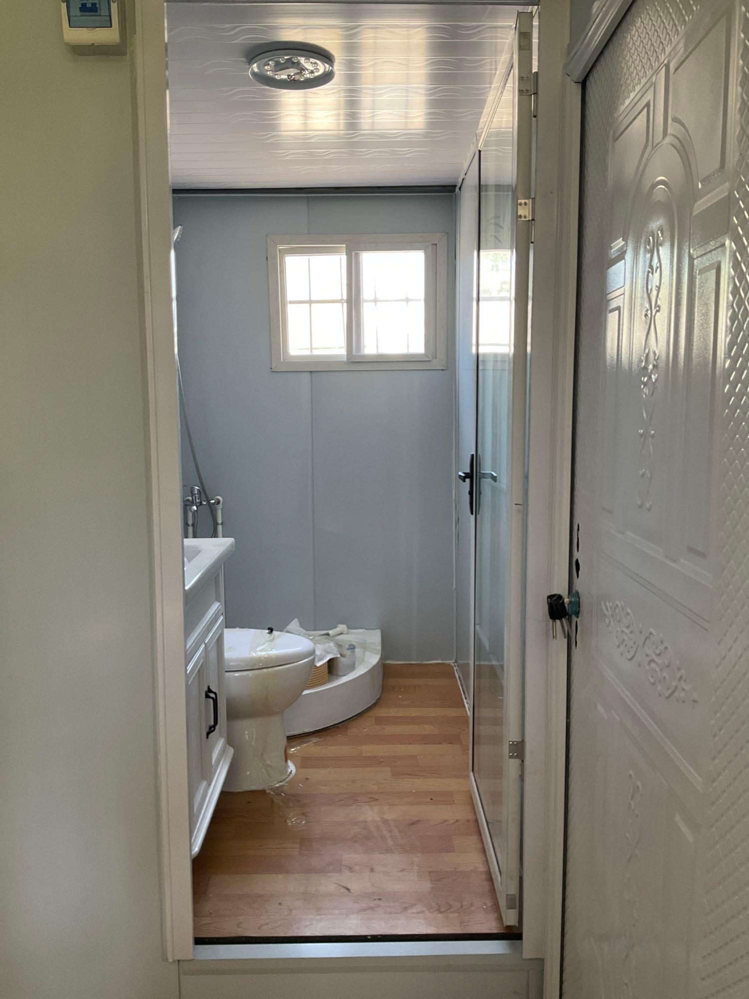 UNUSED EXPANDABLE HOUSE  SHOWER ROOM, TOILET,  PLUMBING AND ELECTRIC HOOK UP, 110V,  LIGHTING , A...