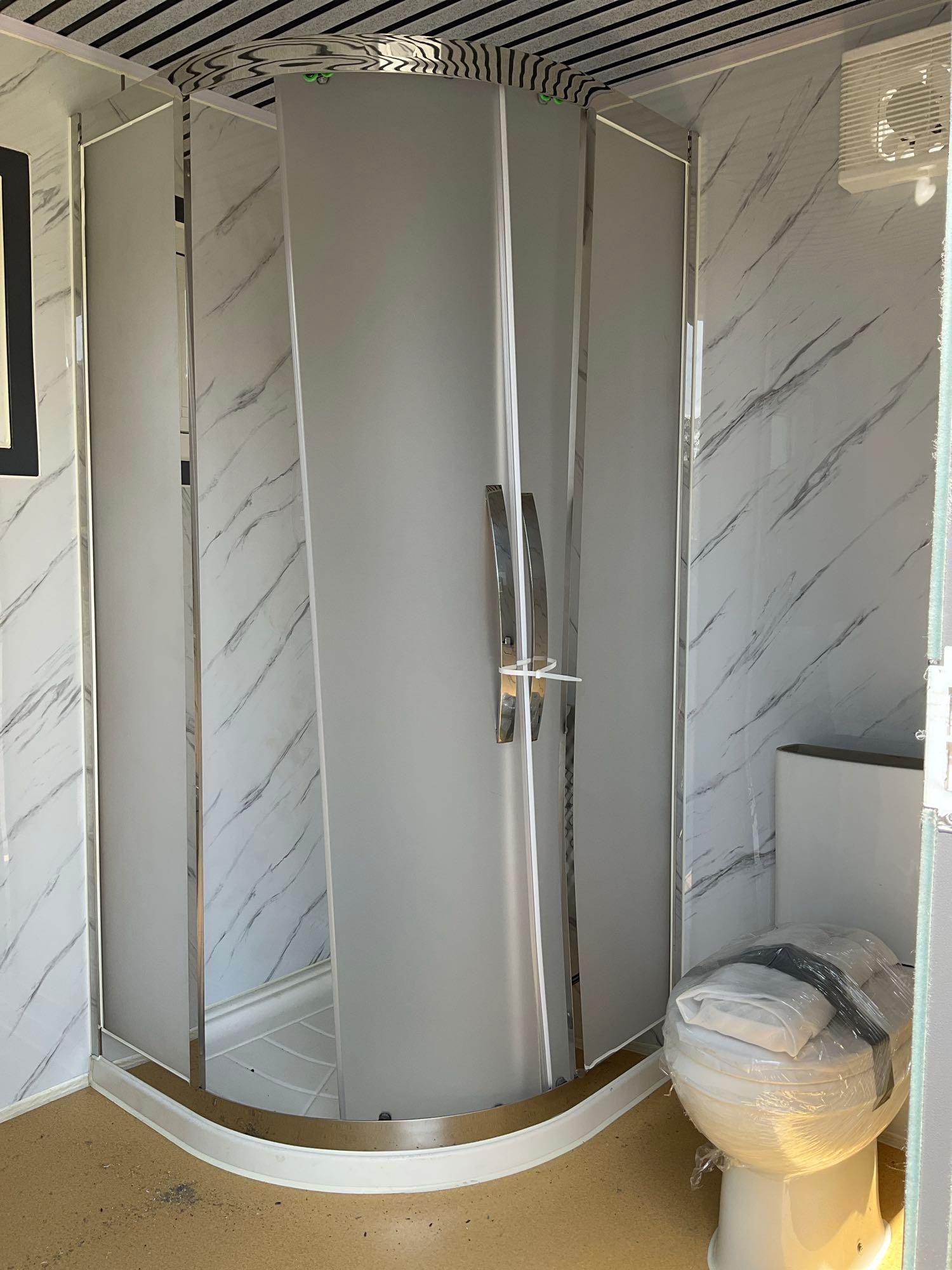 UNUSED PORTABLE BATHROOM UNIT WITH VANITY, SHOWER, TOILET, WINDOW, PLUMBING AND ELECTRIC HOOK UP,...