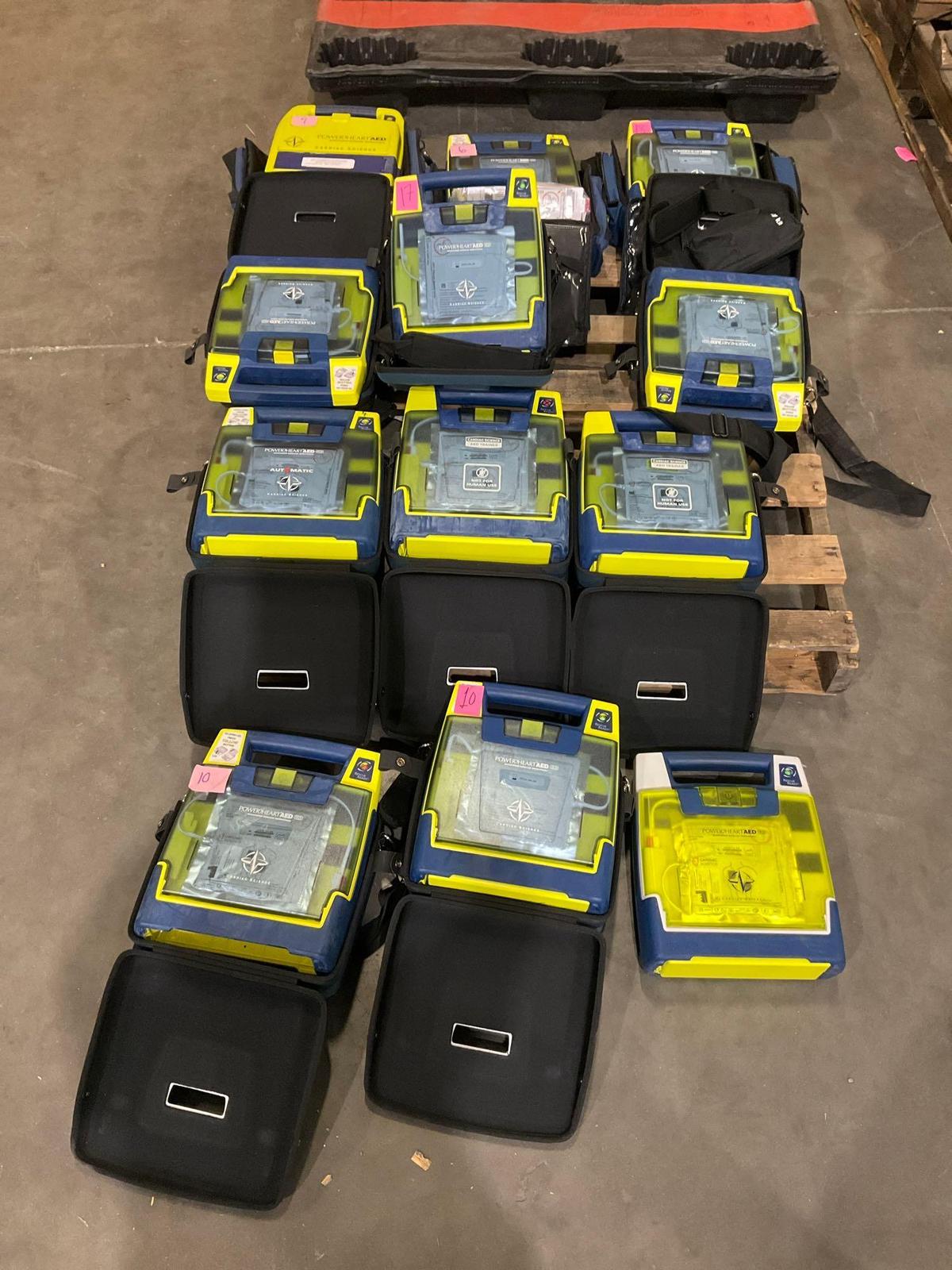 10 CARDIAC SCIENCE AUTOMATED EXTERNAL DEFIBRILLATORS & 2 CARDIAC SCIENCE AED TRAINER...