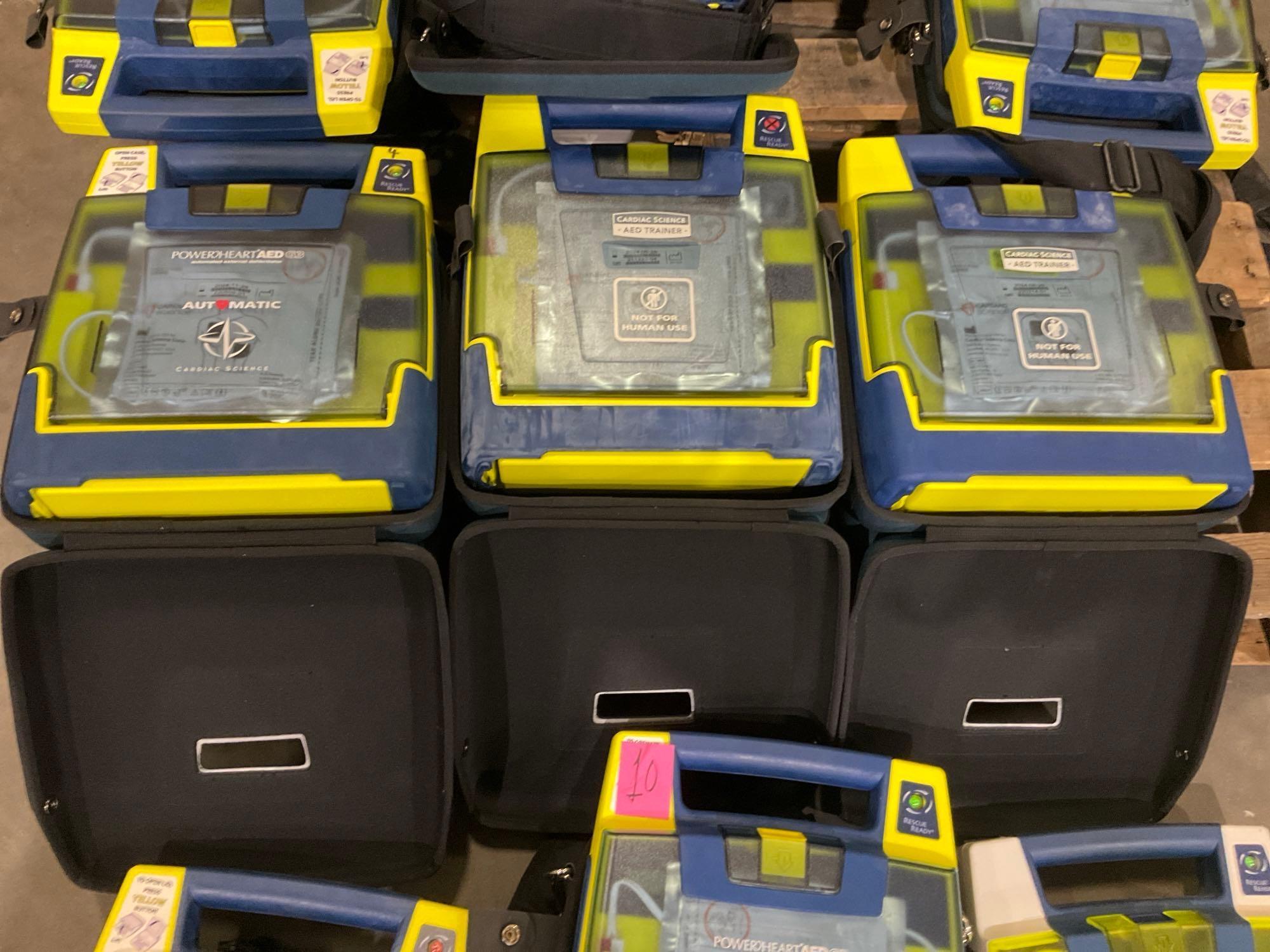 10 CARDIAC SCIENCE AUTOMATED EXTERNAL DEFIBRILLATORS & 2 CARDIAC SCIENCE AED TRAINER...