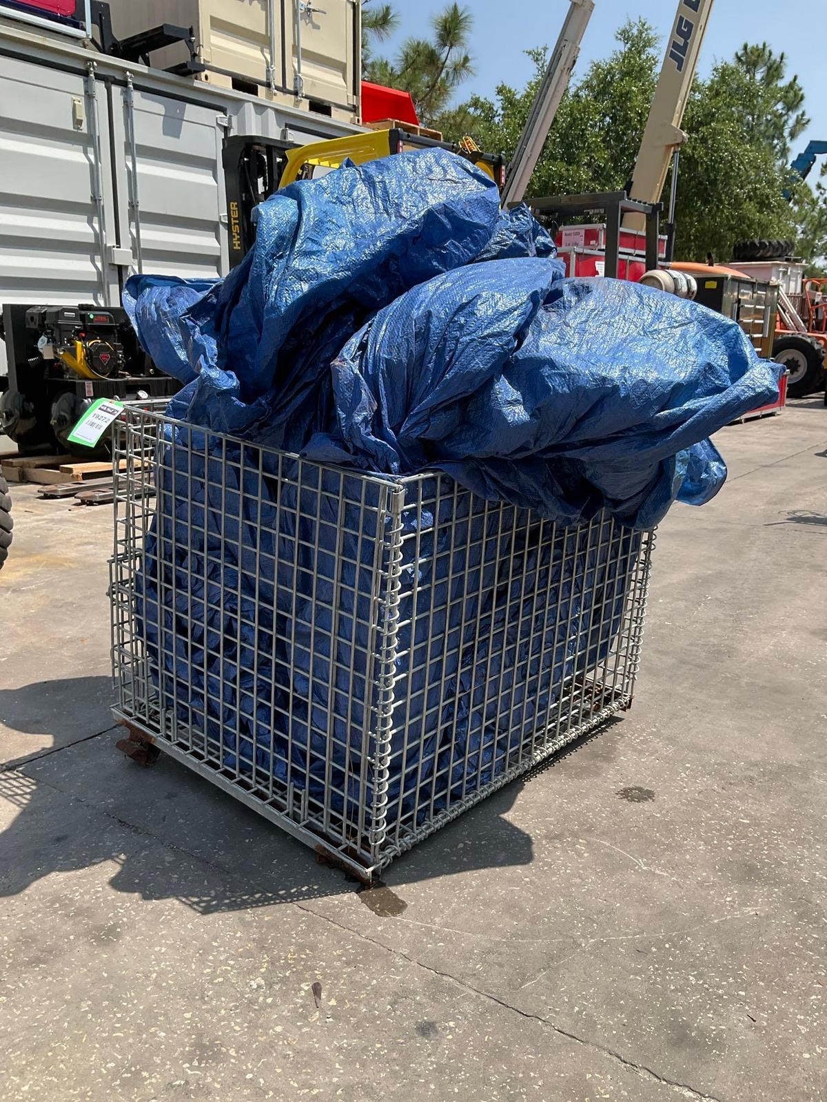 TARP IN WIRE CRATE...