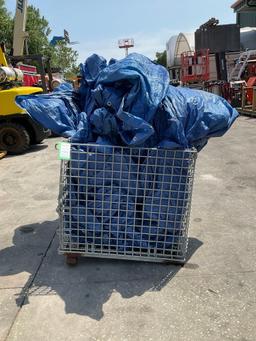 TARP IN WIRE CRATE...