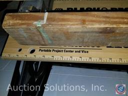 (2) Hirsh folding metal saw horses, and a Black and Decker portable project center and vise.