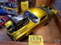 1971 die cast Camaro funny car, gold in color with black racing stripes