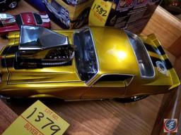 1971 die cast Camaro funny car, gold in color with black racing stripes