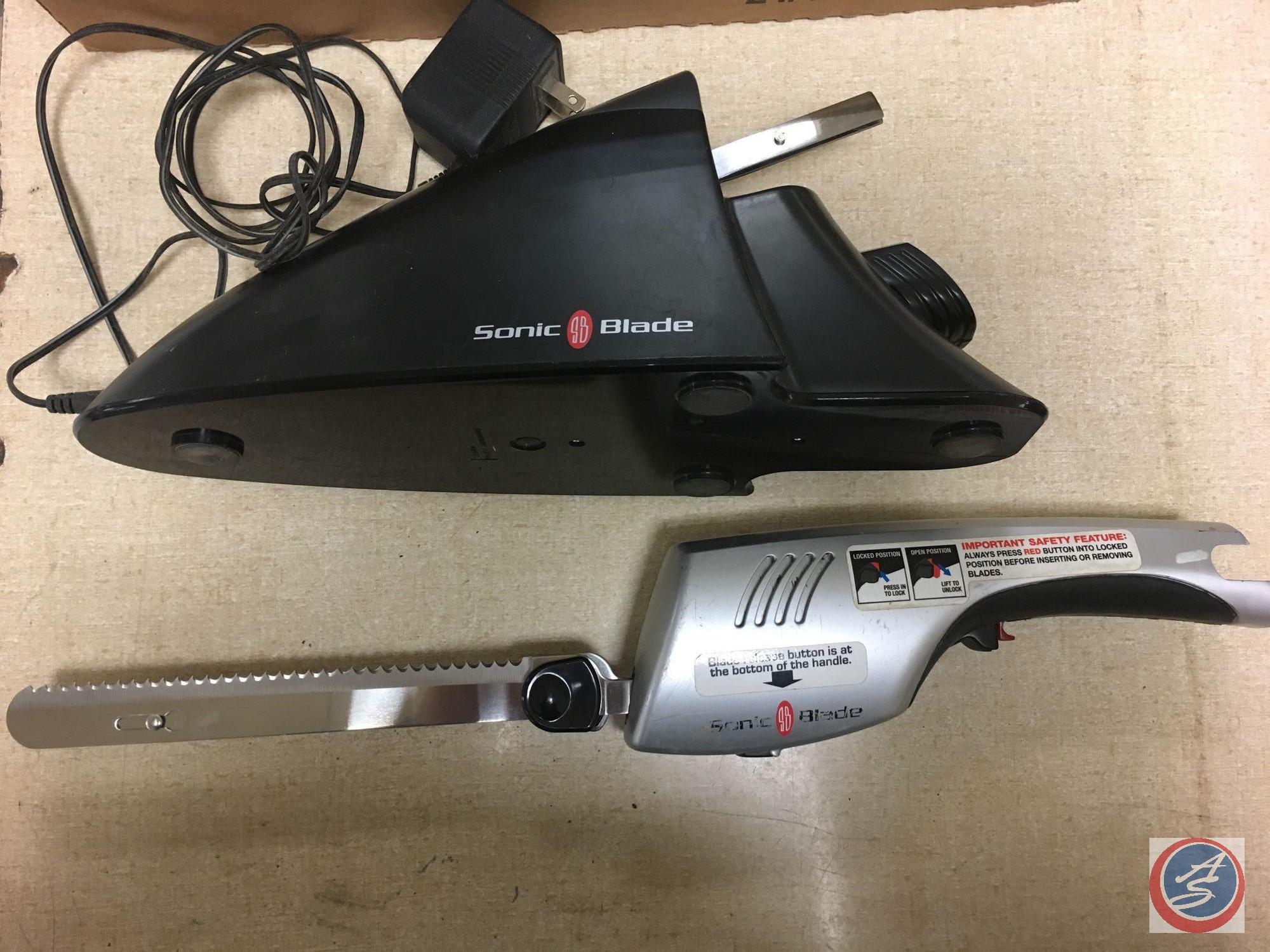 (3) flats containing sonic blade sharpener, Dixon metal pencils, Luma Pro 100 watt light bulb,