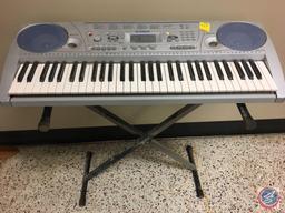 Yamaha keyboard with bass boost and stand