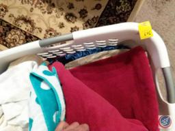 (2) laundry baskets containing pillows, bath linens and pillow cases