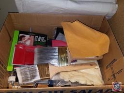 Assorted painting supplies, open cans of paint and spray paint