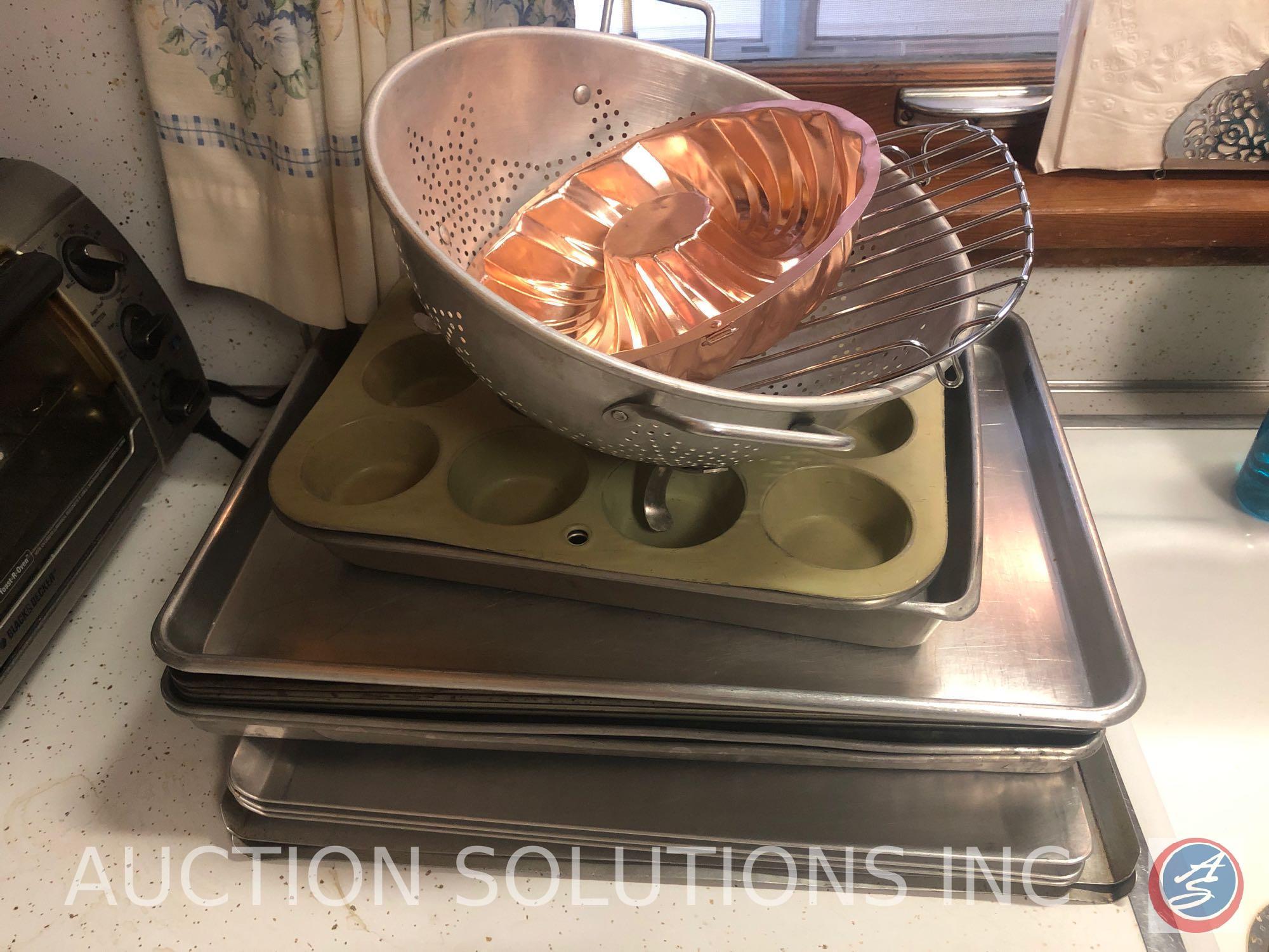 Assorted Glassware, Cookie Sheets, Black and Decker Toaster Oven and Spacemaker Can Opener