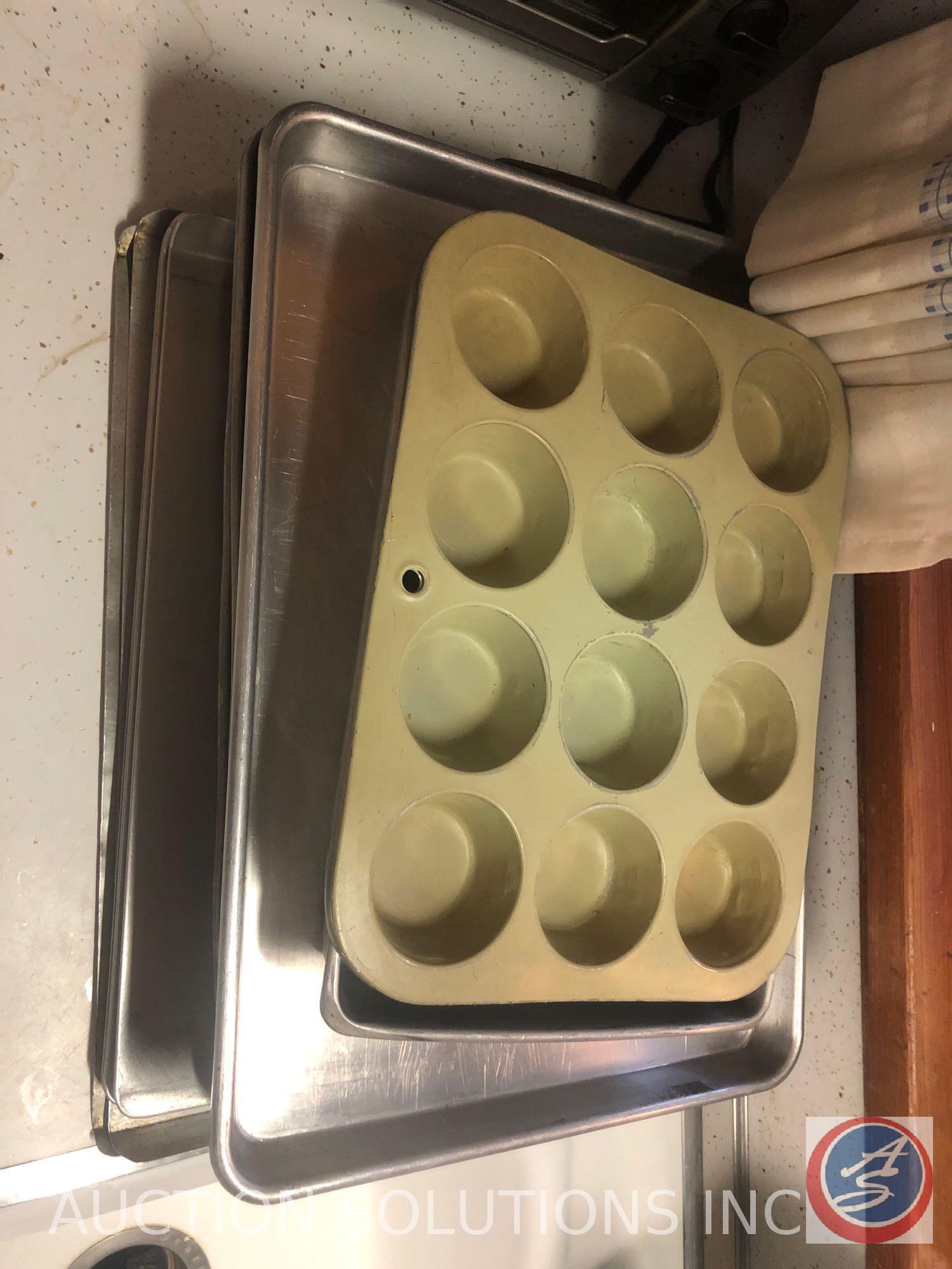 Assorted Glassware, Cookie Sheets, Black and Decker Toaster Oven and Spacemaker Can Opener