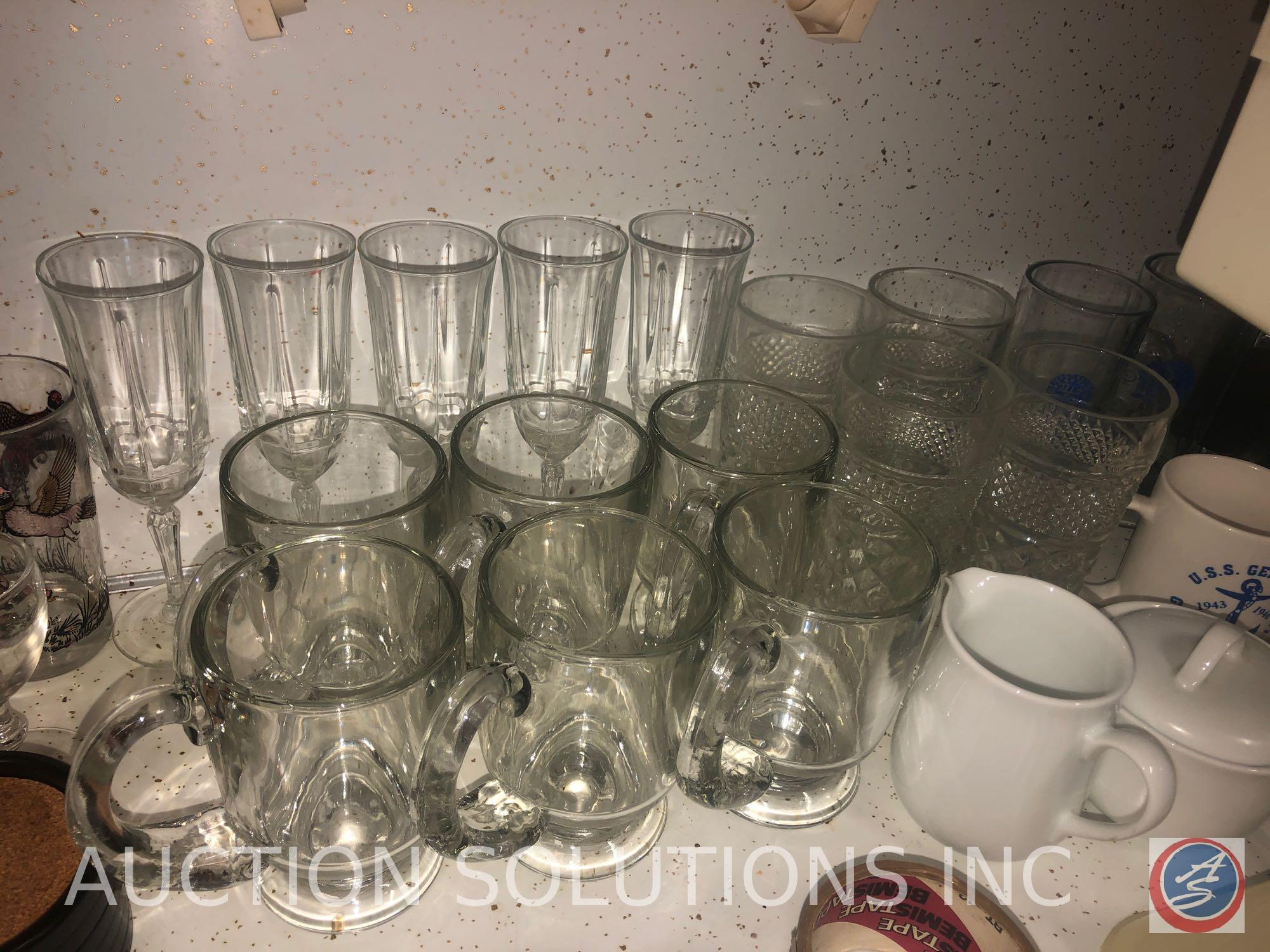 Assorted Glassware, Cookie Sheets, Black and Decker Toaster Oven and Spacemaker Can Opener
