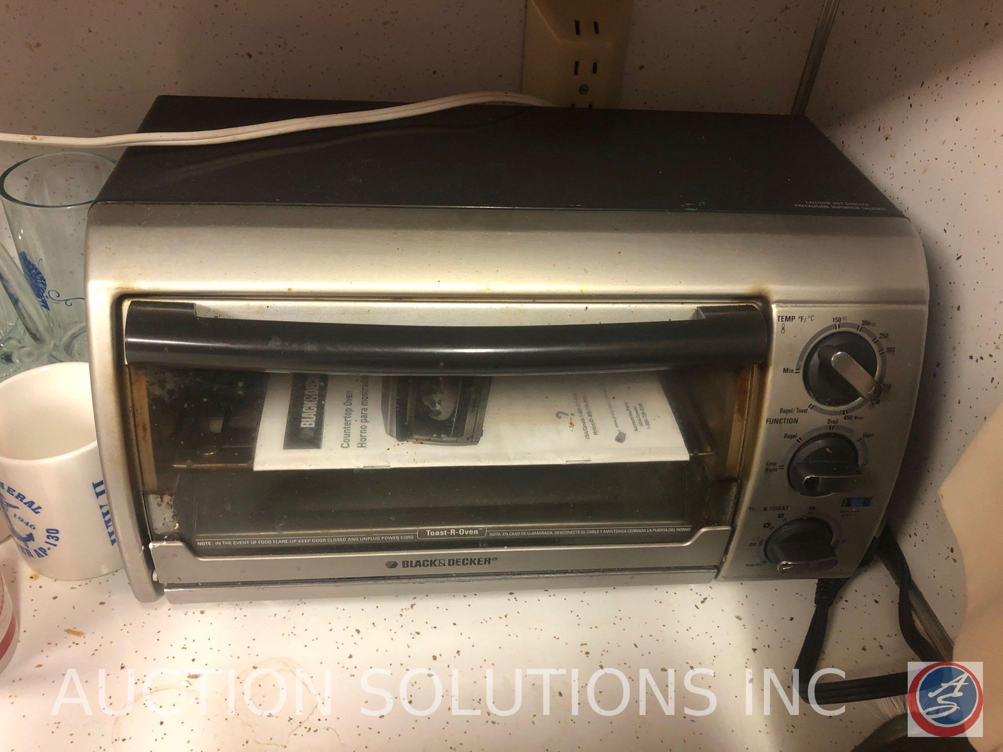 Assorted Glassware, Cookie Sheets, Black and Decker Toaster Oven and Spacemaker Can Opener