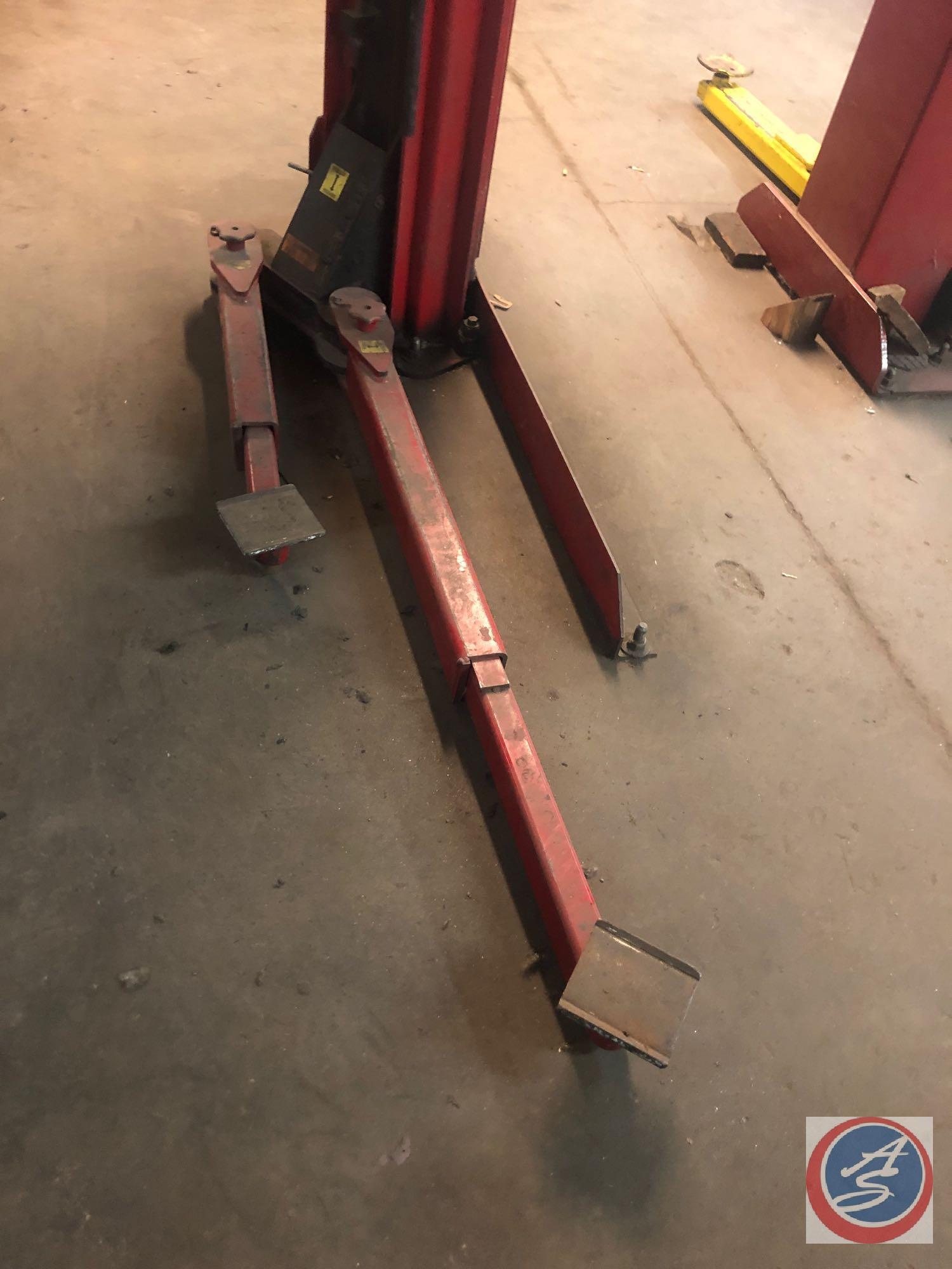 Automotive Lift Institute, Inc. Lift with Gilbarco Swing Rail Two-Post Drive-Thru Model GFF-70