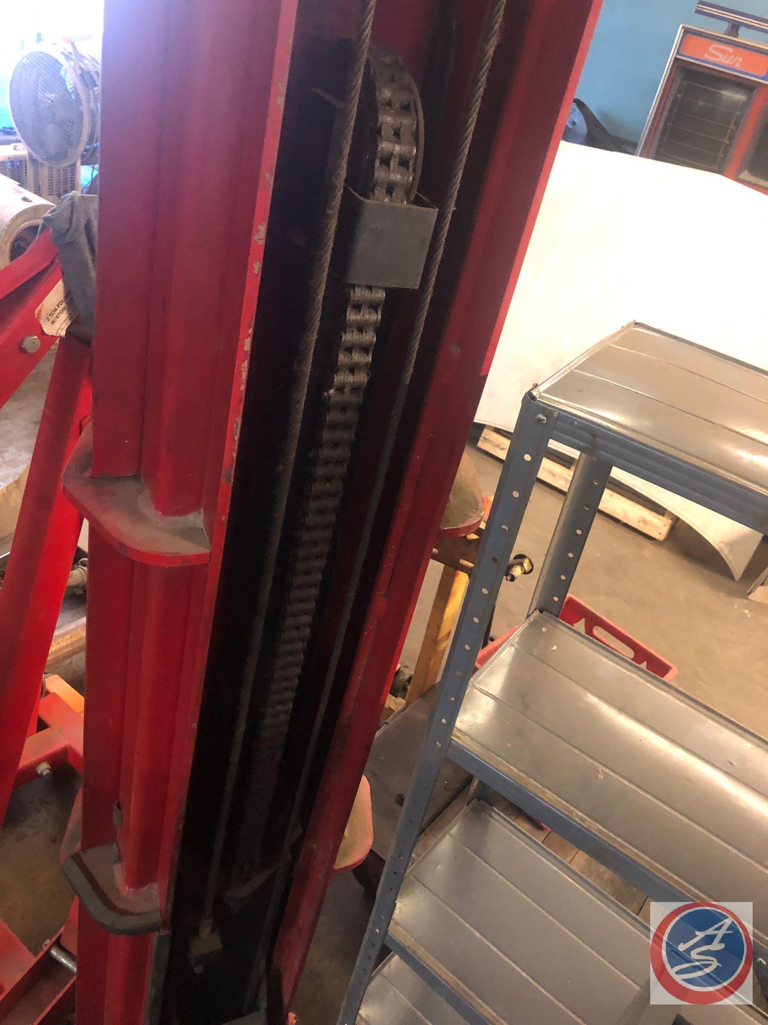 Automotive Lift Institute, Inc. Lift with Gilbarco Swing Rail Two-Post Drive-Thru Model GFF-70