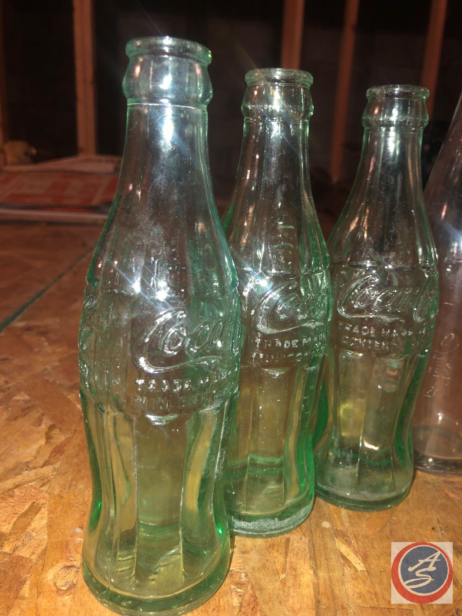 Vintage (1) 10 Fl Oz Coca-Cola Bottle, (3) 6 Fl Oz Coca-Cola Bottles and (2) Clear Bottles [[ALL
