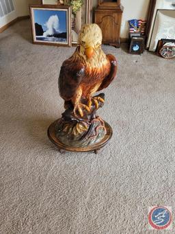 Eagle statue on wooden stand