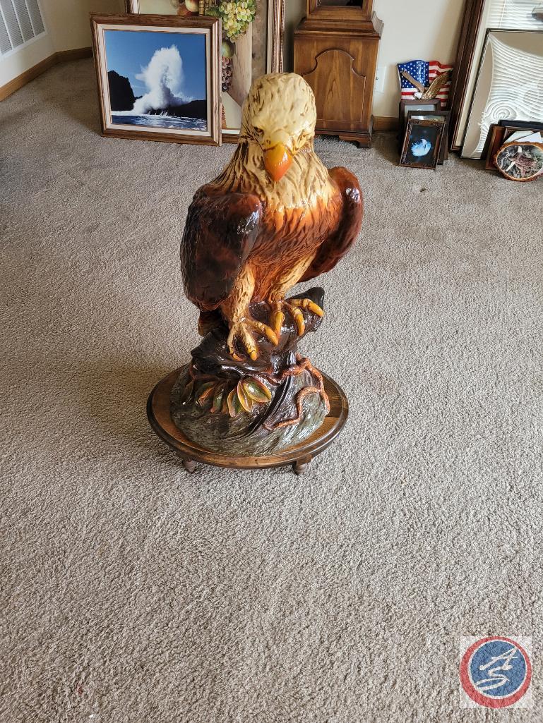 Eagle statue on wooden stand