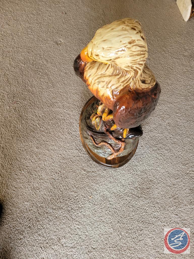 Eagle statue on wooden stand