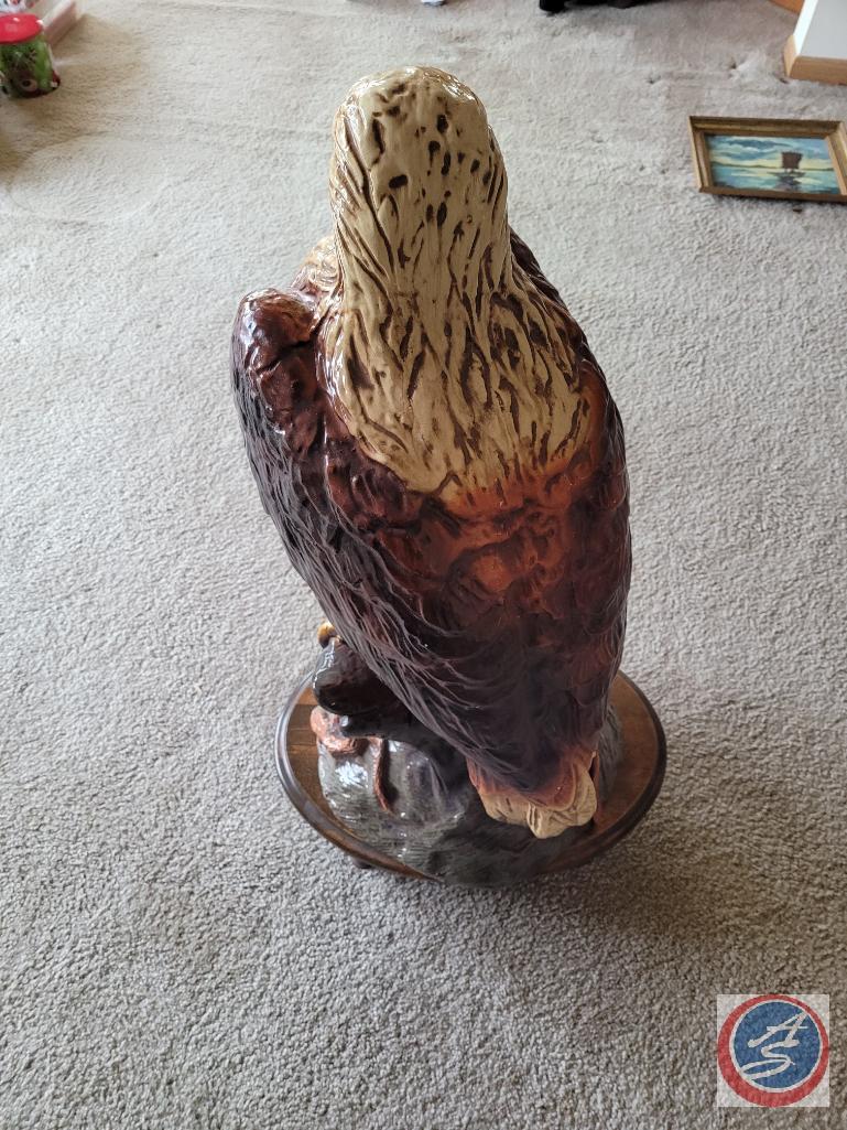Eagle statue on wooden stand