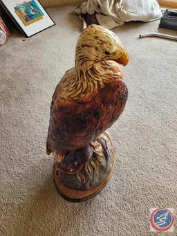 Eagle statue on wooden stand