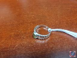 Peridot stone...set in .925 silver size 6