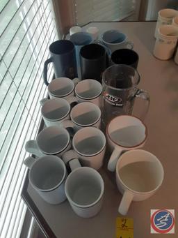 Assorted coffee cups A&W root beer mug.