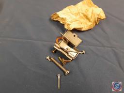 Straps, crescent wrench, mini cutting discs, small pieces of metal