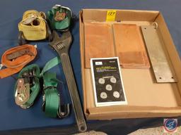 Straps, crescent wrench, mini cutting discs, small pieces of metal