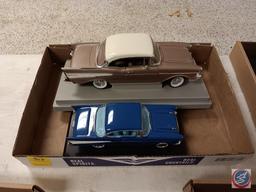 Diecast cars on stands