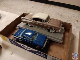 Diecast cars on stands