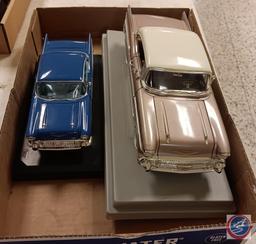 Diecast cars on stands