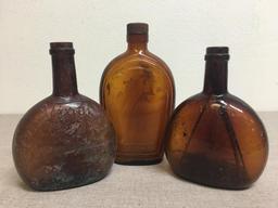 Group of Three Vintage Amber Bottles
