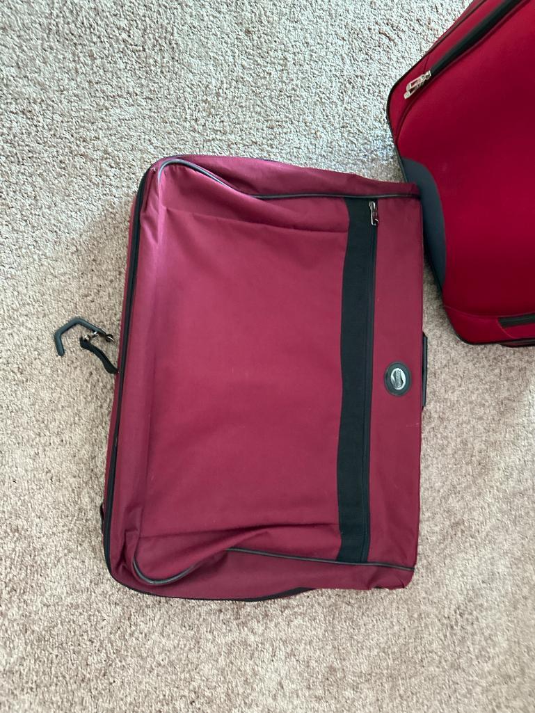 Two Pieces of Tag Luggage and American Tourists Garment Bag