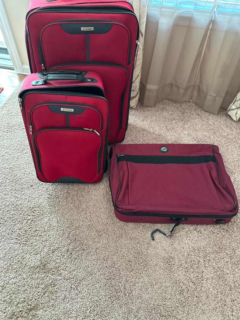 Two Pieces of Tag Luggage and American Tourists Garment Bag