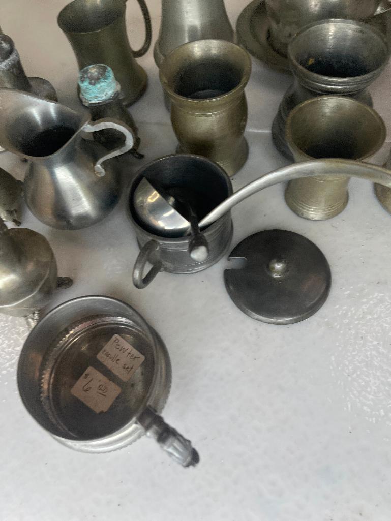 Large assortment of pewter pieces