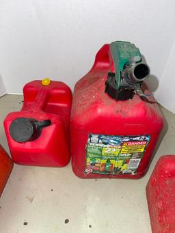 Group of Four Small Plastic Gasoline Cans