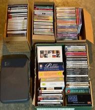 Group of Audio CDs and Case