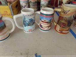 COLLECTION OF FOUR MILLER BEER STEINS