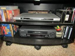 ENTERTAINMENT CENTER PANASONIC 42 INCH FLAT SCREEN TV AND DVD AND VCR ETC