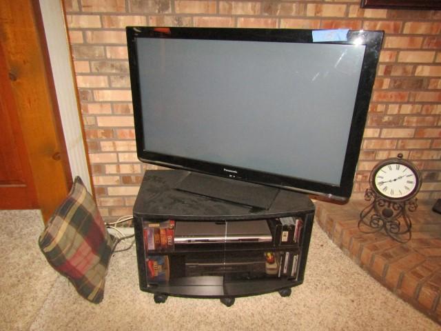ENTERTAINMENT CENTER PANASONIC 42 INCH FLAT SCREEN TV AND DVD AND VCR ETC