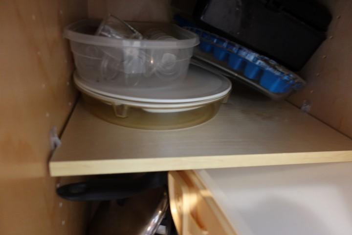CABINET LOT INCLUDING FLATWARE DRY CONTAINERS COOKWARE AND PLASTIC STORAGE