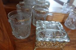 CONTENTS OF CABINET INCLUDING ICE BUCKETS STEMWARE GLASSES AND COVERED SERV