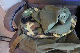 LARGE OFFICE CHAIR WITH MILITARY BAGS AND CAMMO BAGS AND TRUMP SIGN