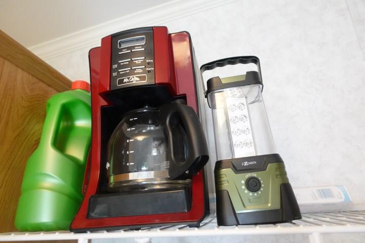 CONTENTS OF LAUNDRY ROOM SHELVES INCLUDING MR COFFEE LANTERN CLEAN SUPPLIES